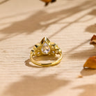 seven stone bezel pear shape moissanite engagement ring