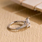 pear cut moissanite engagement ring pavé band gold