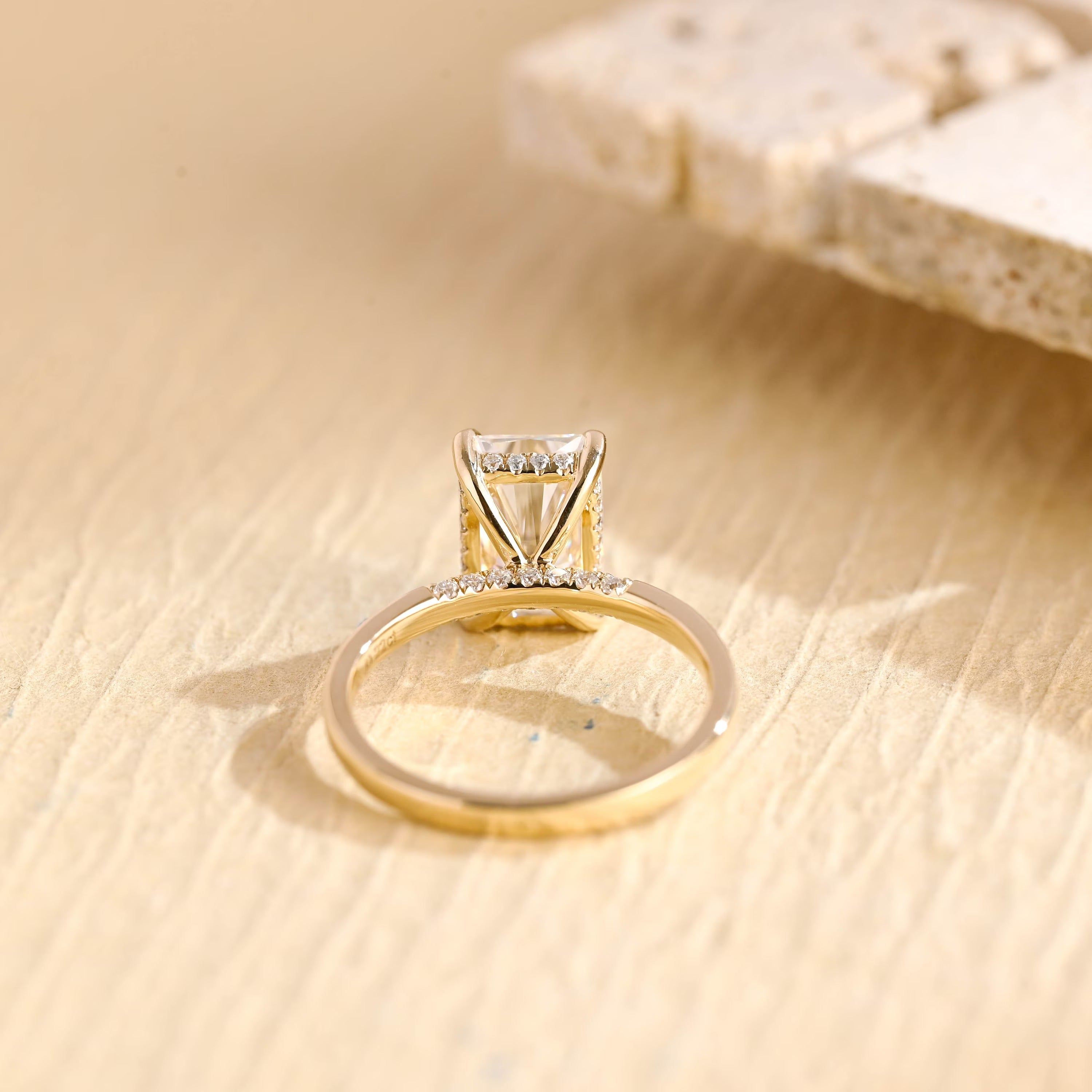 hidden halo moissanite engagement ring radiant cut gold