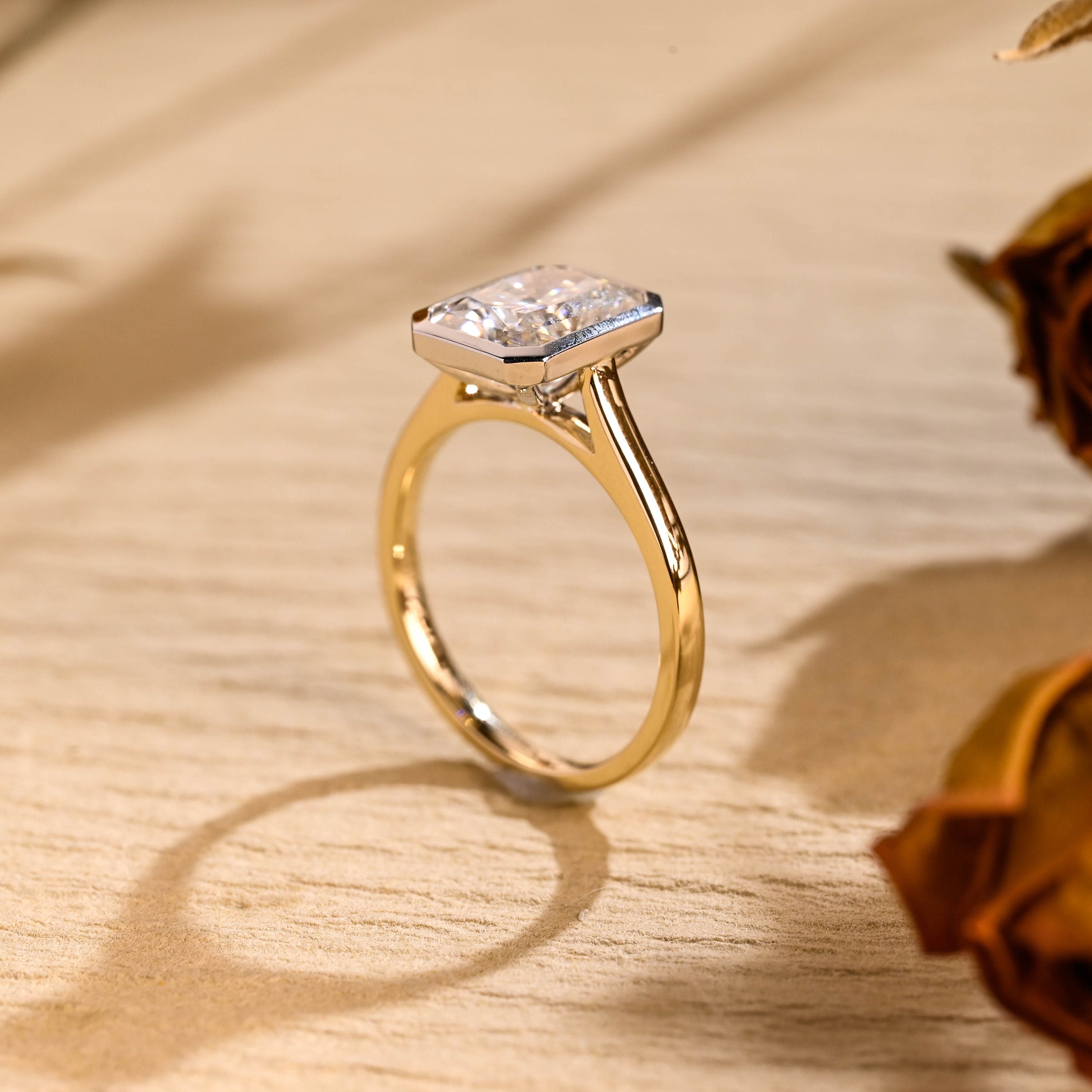 gold bezel moissanite engagement ring radiant cut