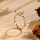 gold bezel moissanite engagement ring radiant cut