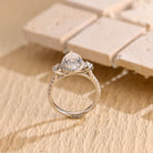 sparkling pear cut three stone moissanite ring