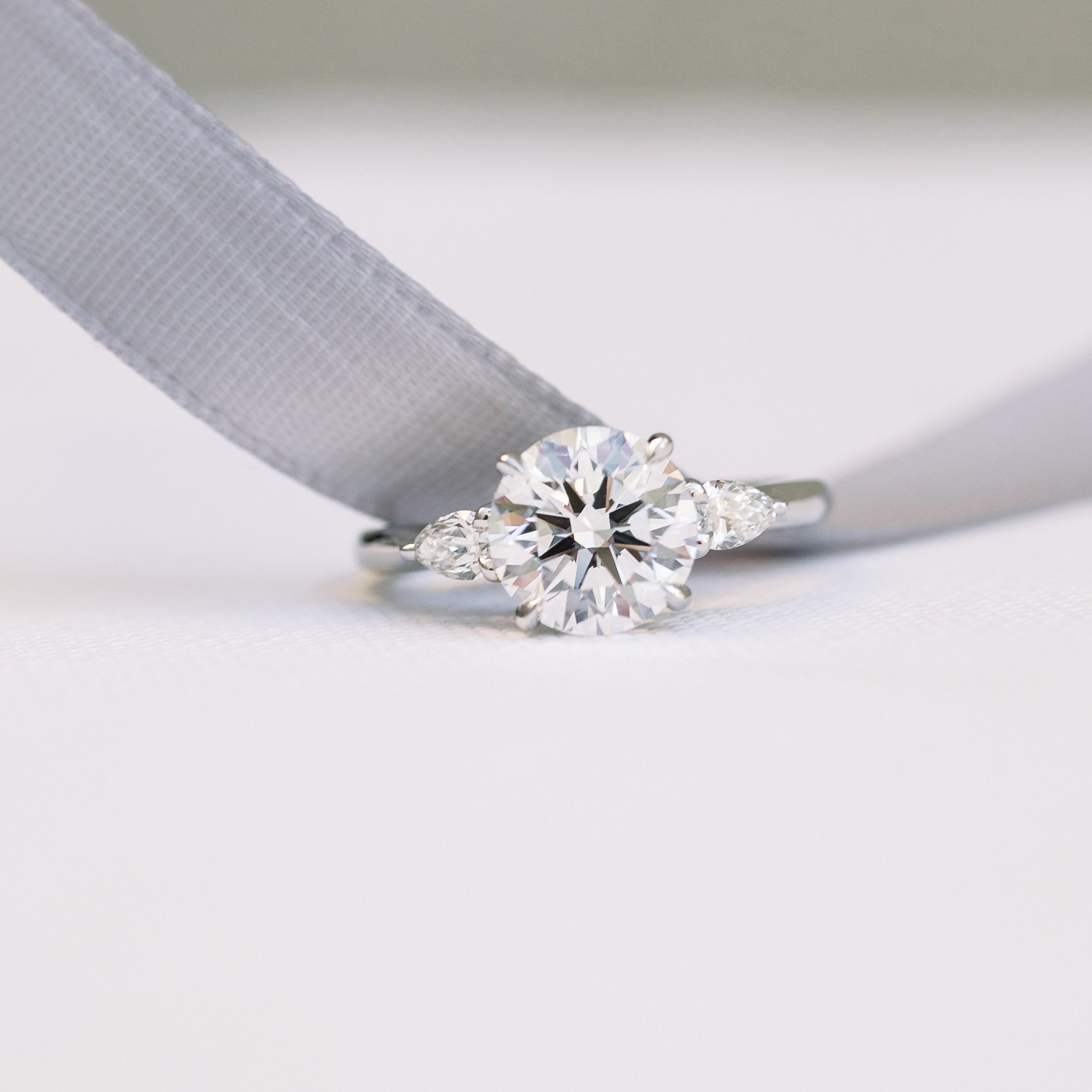 Round and Pear Moissanite Ring